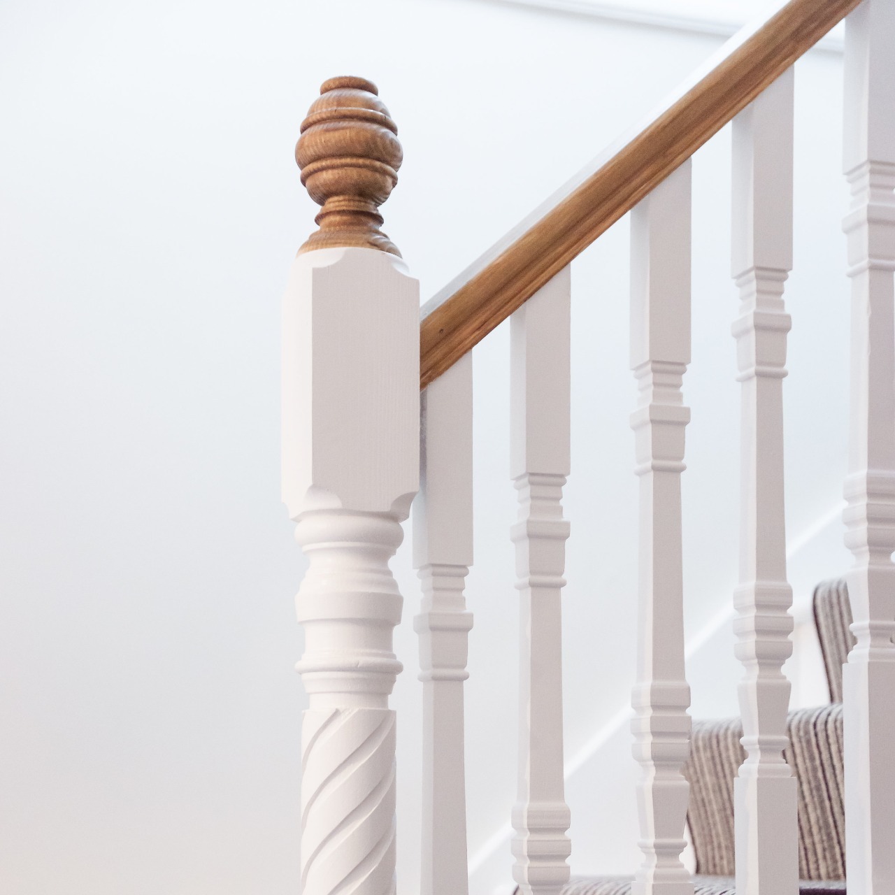 Newel posts and newels caps on traditional staircase 